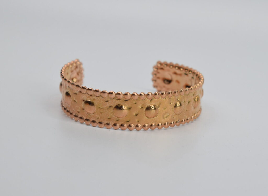 STEEL BEATEN HANDCUFF IN GOLDEN PINK COLOUR WITH TROUCS.